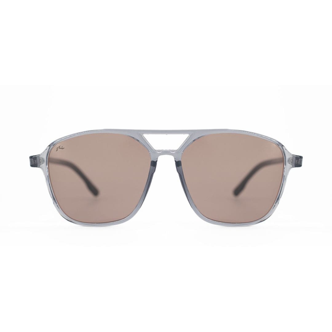 ANTEOJO DE SOL RUSTY THE TAKE L GREY SBLK L BROWN FRENTE ANTEOJO DE SOL RUSTY THE TAKE L GREY SBLK L BROWN FRENTE. ARMAZON G-FLEX CON PATILLAS SISTEMA FLEXO. MODELO DE COLOR TRANSLUCIDO Y LENTES COLOR MARRON ROSADO CLARO